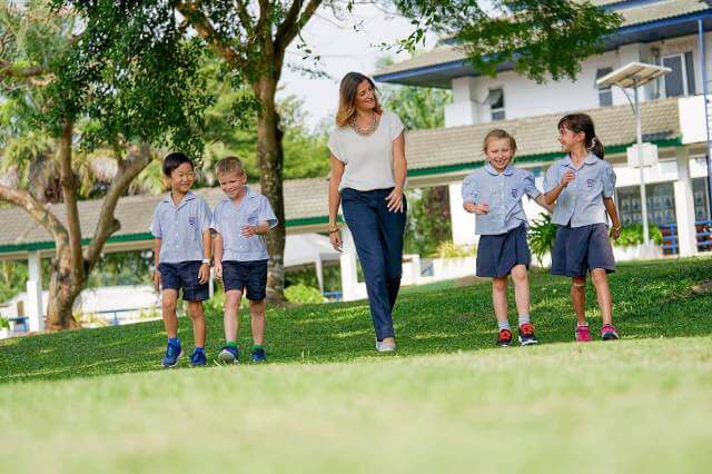 students with teacher for outdoor activities